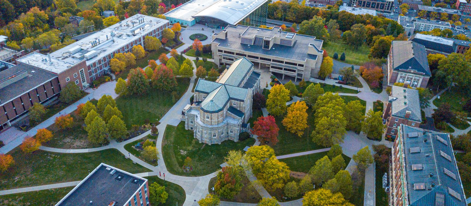 Aerial view of a university campus among autumn trees